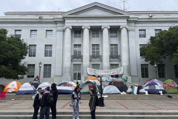 Pro-Palestinian protesters gather near an encampment set up in front of Sproul Hall on the campus of the University of California, Berkeley in Berkeley, Calif., Tuesday, April 23, 2024. The Israel-Ham ...