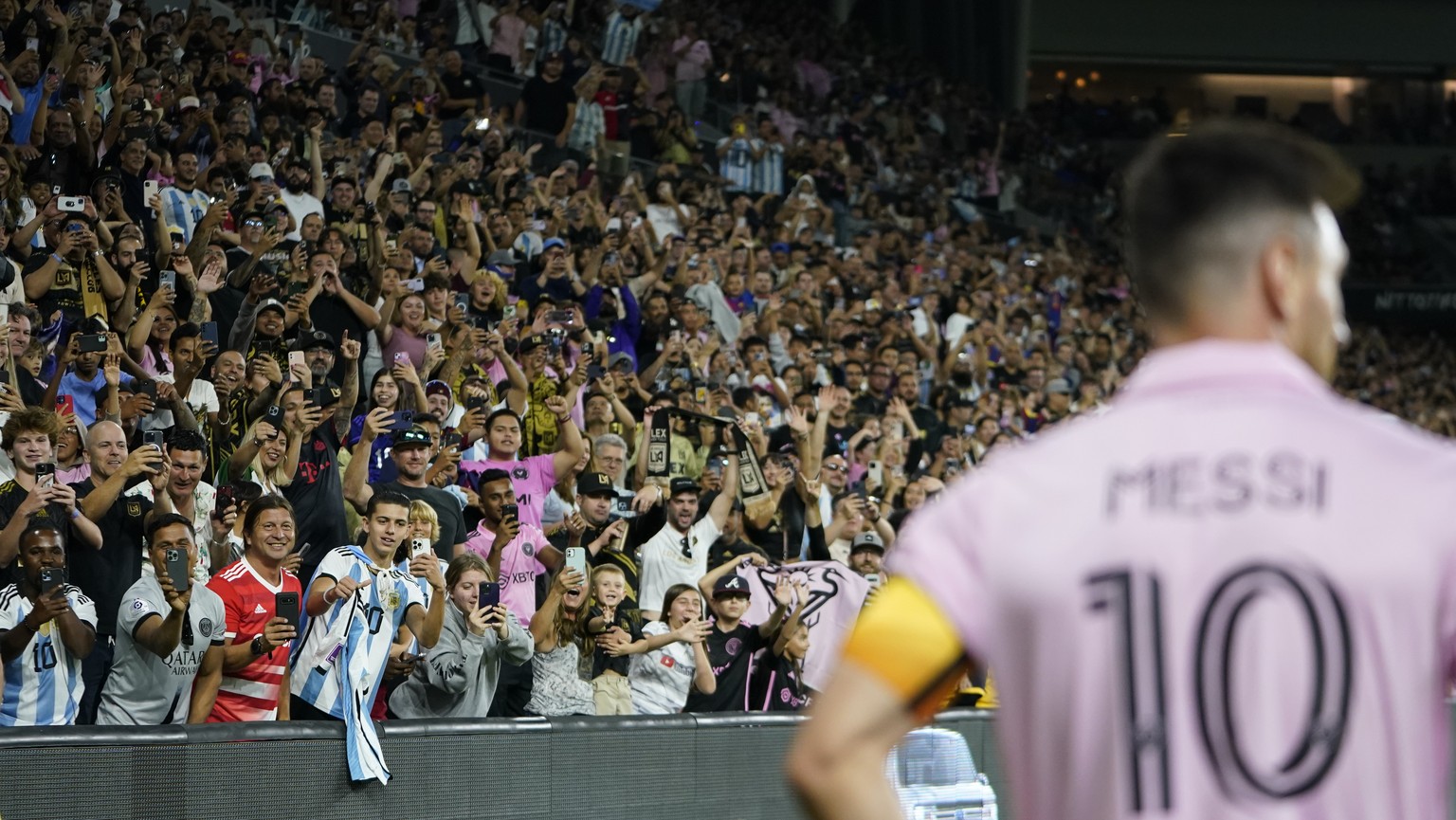 Fans cheer as Inter Miami forward Lionel Messi (10) waits for a corner kick during the second half of an MLS soccer match against Los Angeles FC, Sunday, Sept. 3, 2023, in Los Angeles. (AP Photo/Ryan  ...