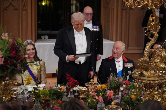 US President Donald Trump delivers his speech as King Charles III and the Princess of Wales listen during the state banquet for the US President and First Lady Melania Trump at Windsor Castle, Berkshi ...