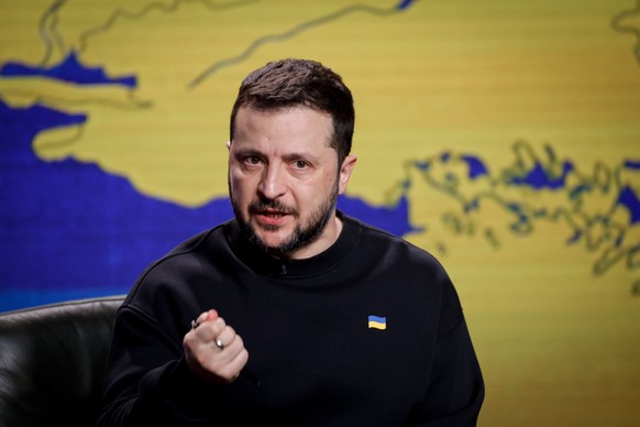 epa11037493 Ukrainian President Volodymyr Zelensky gestures as he responds to questions from journalists during a press conference in Kyiv (Kiev), Ukraine, 19 December 2023. Zelensky spoke with the me ...