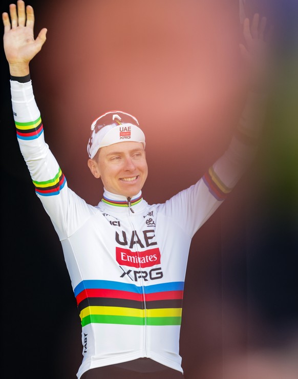 epa12870848 Slovenian cyclist Tadej Pogacar of UAE Team Emirates XRG poses on the podium after the Tour of Flanders one-day cycling race, in Oudenaarde, Belgium, 05 April 2026. EPA/OLIVIER MATTHYS