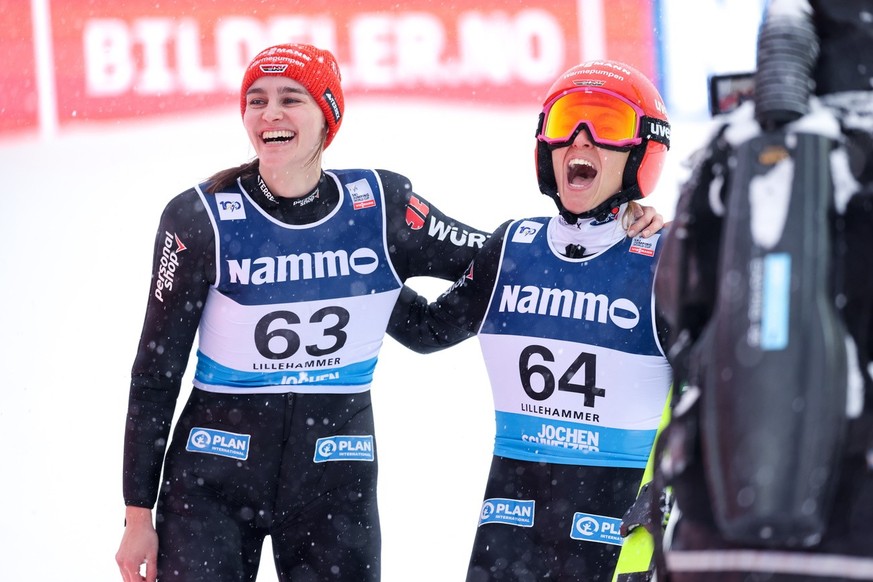 epa11737954 German Katharina Schmid (right) celebrates with Selina Freitag after she won the FIS Ski Jumping World Cup event on the large hill (H134) in Lillehammer, Norway, 24 November 2024. EPA/Geir ...