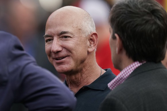 FILE - Amazon founder Jeff Bezos is seen on the sidelines before the start of an NFL football game on Sept. 15, 2022, in Kansas City, Mo. A former housekeeper for Bezos says she and other employees su ...