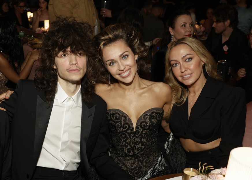 LOS ANGELES - FEBRUARY 4: Maxx Morando, Miley Cyrus, and Brandi Cyrus behind the scenes at The 66th Annual Grammy Awards, airing live from Crypto.com Arena in Los Angeles, California, Sunday, Feb. 4 ( ...