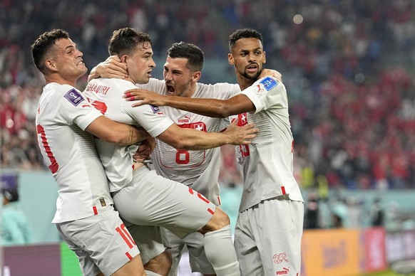 Switzerland&#039;s Xherdan Shaqiri, second left, celebrates with teammates after scoring his side&#039;s opening goal during the World Cup group G soccer match between Serbia and Switzerland, at the S ...