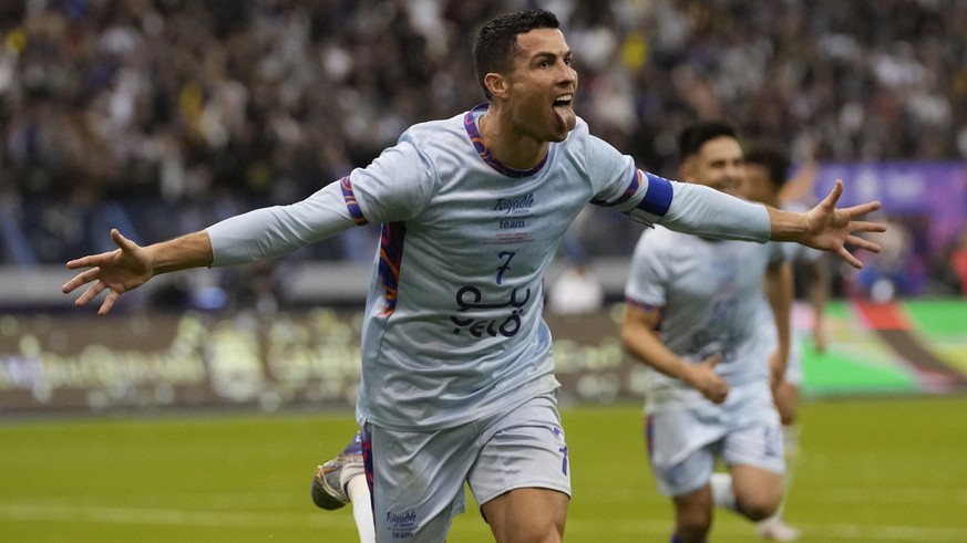 Cristiano Ronaldo celebrates after scoring his side&#039;s second goal playing for a combined XI of Saudi Arabian teams Al Nassr and PSG during a friendly soccer match, at the King Saud University Sta ...