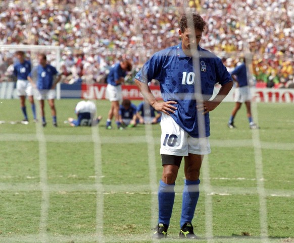 FILE - Roberto Baggio of Italy looks disappointed after Brazilian goalkeeper Taffarel saved his penalty shot, during the World Cup Final, in Pasadena, Ca., USA, on July 17, 1994. Brazil defeated Italy ...