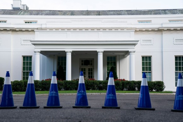 WASHINGTON, DC - JULY 10: Traffic cones with an image of the White House are seen outside of the West Wing of the White House on July 10, 2022 in Washington, DC. (Photo by Sarah Silbiger/Getty Images)