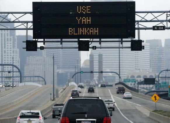 An electronic highway sign is seen on Interstate 93 in Boston, Friday, May 9, 2014. The Massachusetts Dept. of Transportation posted the message "Changing Lanes? Use Yah Blinkah" on ...