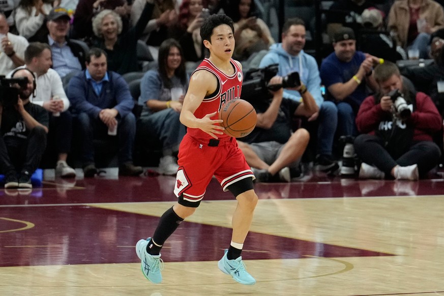 Chicago Bulls guard Yuki Kawamura (8) brings the ball up the court in the second half of a preseason NBA basketball game against the Cleveland Cavaliers Tuesday, Oct. 7, 2025, in Cleveland. (AP Photo/ ...