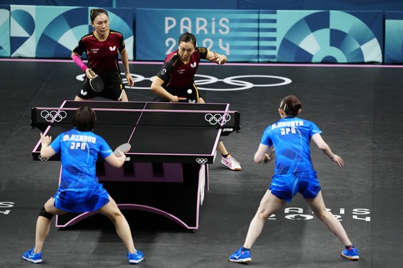 Germany&#039;s Yuan Wan, background right, and Xiaona Shan play against Japan&#039;s Hina Hayata and Miu Hirano during the women&#039;s teams semifinal table tennis match at the 2024 Summer Olympics,  ...