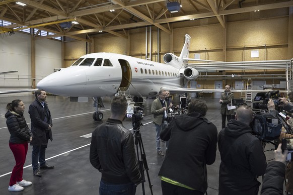 Christian Winter, center, Swiss Ambassador of Sudan, with Swiss Federal Councilor Ignazio Cassis, behind Winter, speaks during a press conference at the Bern-Belp Airport in Belp, Switzerland, Tuesday ...