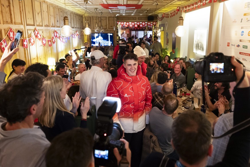 KEYPIX - Gold medalist Switzerland's Franjo von Allmen and bronze medalist Marco Odermatt are welcomed by family members, friends and supporters as they arrive at the House of Switzerland in the  ...