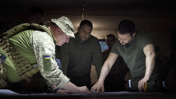 epa10712925 A handout photo made available by the Ukrainian Presidential Press Service shows Ukraine&#039;s President Volodymyr Zelensky (R) speaking with commanders as he visits the country&#039;s Ar ...