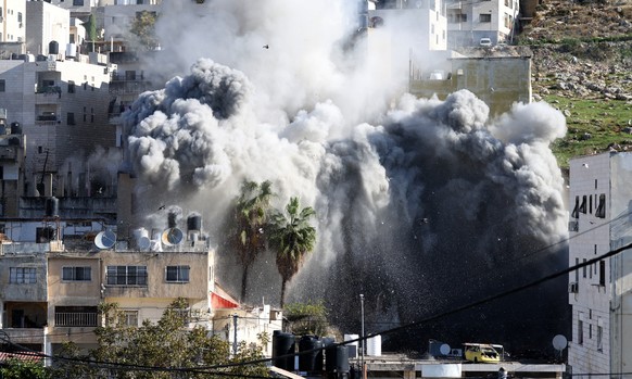 epa12563851 Israeli troops demolish the house of Palestinian prisoner Abdul Karim Sanoubar in the West Bank city of Nablus, 02 December 2025. According to the Palestinian news agency Wafa, Israeli for ...