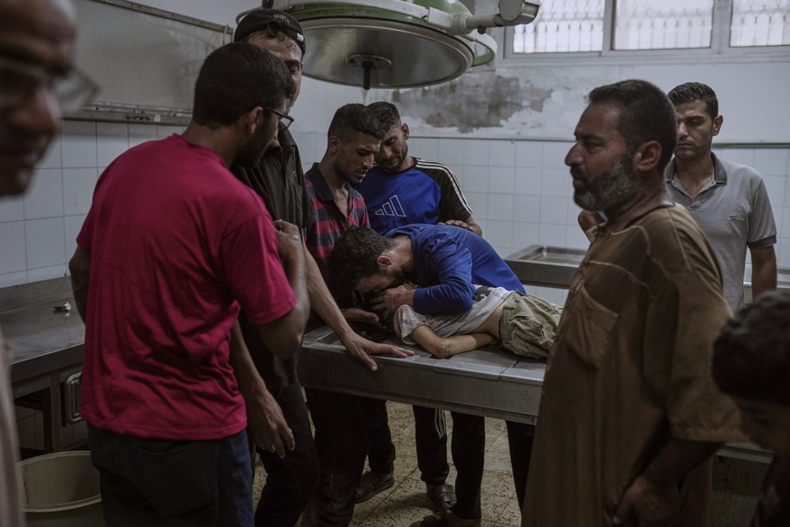Palestinians mourn a child killed in an Israeli military airstrike on Gaza, at the morgue of Shifa Hospital in Gaza City, Saturday, July 12, 2025. (AP Photo/Jehad Alshrafi)
APTOPIX Israel Palestinians