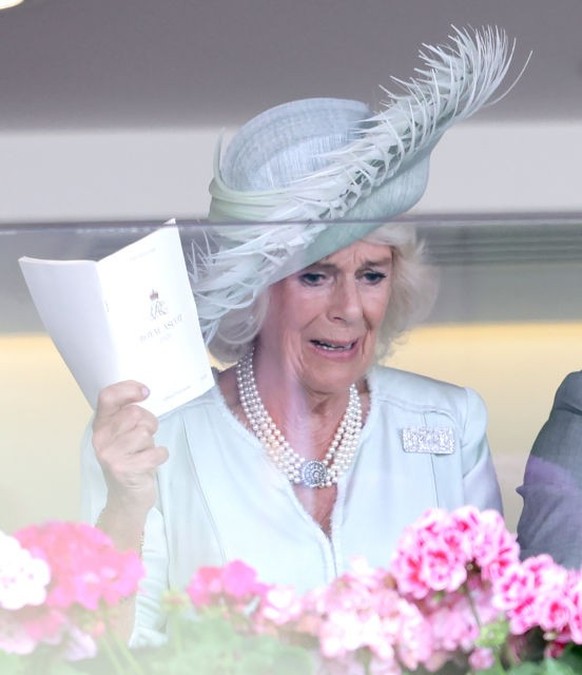 ASCOT, UNITED KINGDOM - JUNE 24: (EMBARGOED FOR PUBLICATION IN UK NEWSPAPERS UNTIL 24 HOURS AFTER CREATE DATE AND TIME) Queen Camilla, King Charles III and Lady Gabriella Windsor watch, from the Royal ...