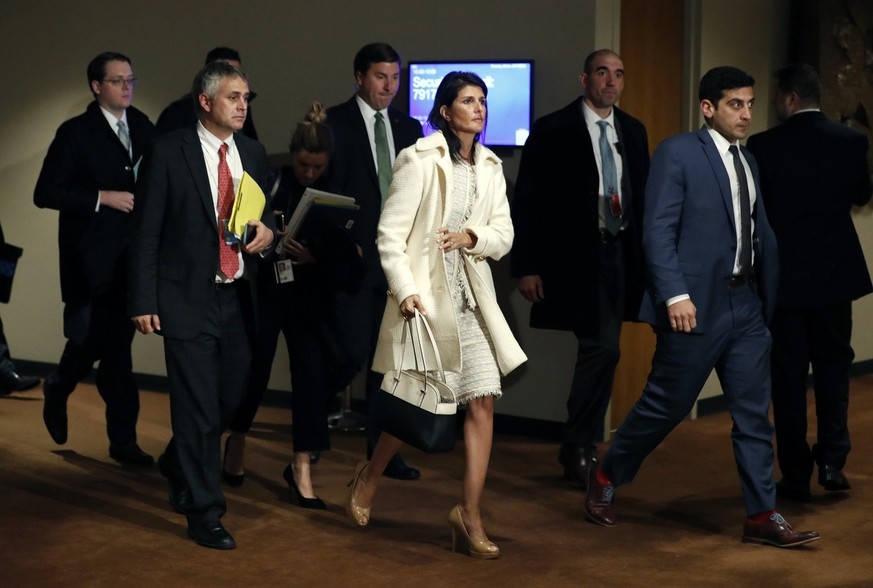 epa05893526 United States Ambassador to the United Nations Nikki Haley (C) leaves the Security Council consultations room outside the United Nations (UN) Security Council, after a meeting on the situa ...