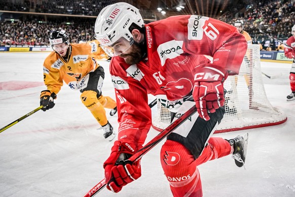 Pardubice&#039;s Martin Kaut, right, against Kuopio&#039;s Colby Sisso during the game between HC Dynamo Pardubice and Finnland&#039;s KalPa Kuopio, at the 95th Spengler Cup ice hockey tournament in D ...