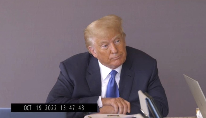 In this image taken from video released by Kaplan Hecker &amp; Fink, former President Donald Trump pauses during his Oct. 19, 2022, deposition for his trial against writer E. Jean Carroll. The video r ...
