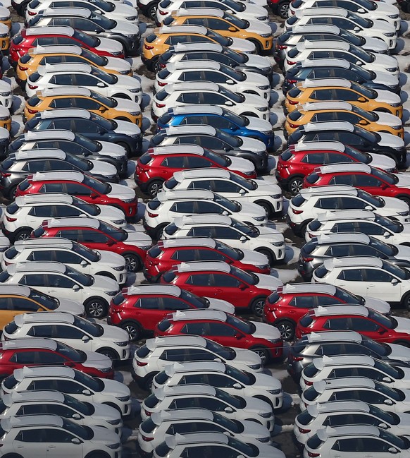 epa11887455 Cars waiting for shipment are packed at a port in Pyeongtaek, South Korea, 11 February 2025. US President Donald Trump announced plans the previous day to impose 25 percent tariffs on all  ...