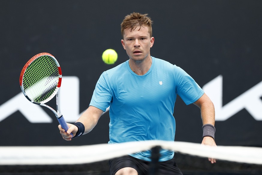 MELBOURNE, AUSTRALIA - JANUARY 17: Stefan Kozlov of United States plays a forehand in his first round singles match against Jiri Vesely of Czech Republic during day one of the 2022 Australian Open at  ...