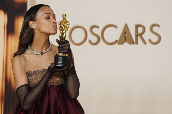 Zoe Saldana, winner of the award for best performance by an actress in a supporting role for &quot;Emilia Perez,&quot; poses in the press room at the Oscars on Sunday, March 2, 2025, at the Dolby Thea ...