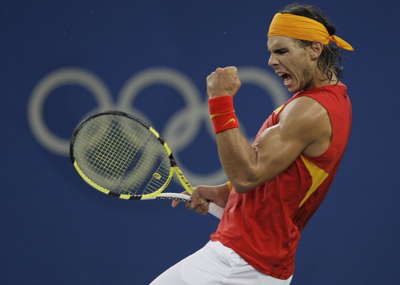 FILE - This photo by Associated Press photographer Elise Amendola shows Rafael Nadal of Spain reacting after winning a point against Fernando Gonzalez of Chile during their Gold medal singles tennis m ...