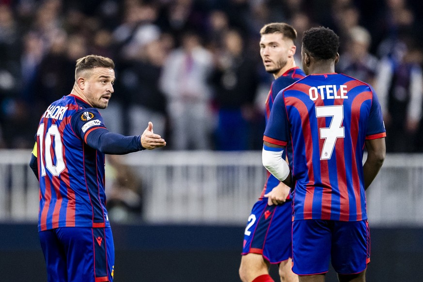 Basel&#039;s Xherdan Shaqiri, left, speaks with Basel&#039;s Philip Otele, right, during the UEFA Europa League soccer League phase matchday 3 between France&#039;s Olympique Lyonnais and Switzerland& ...