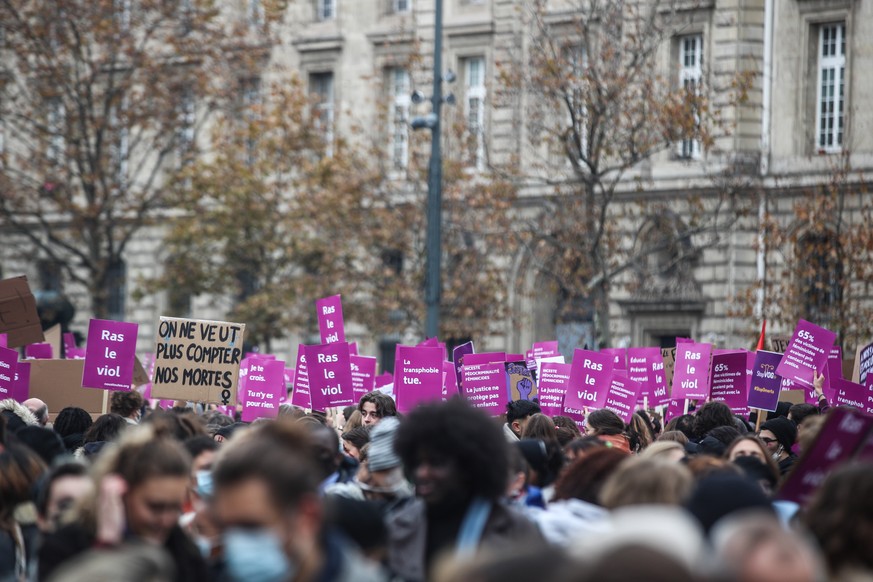 epa09593571 People participate in a protest against sexual and sexist attacks on women, in Place de La Republique in Paris, France, 20 November 2021. The protest was organised by feminist collective a ...