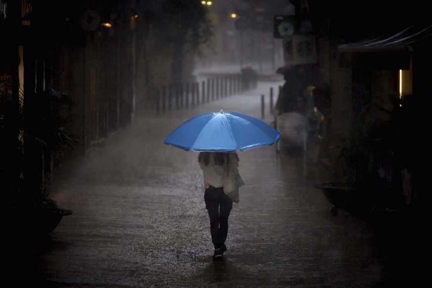 A woman walks in heavy rain in Barcelona, Spain, Thursday, Sept. 11, 2025. (AP Photo/Emilio Morenatti)
APTOPIX Spain Weather