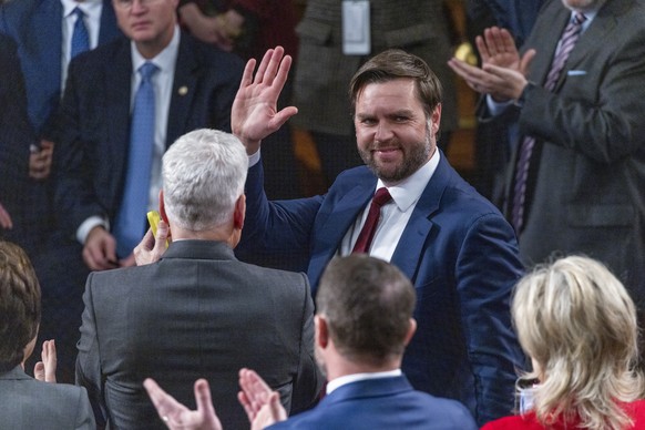 epa11810225 US Vice President-elect JD Vance waves following the electoral vote certification in President-elect Trump&#039;s election victory, which took place on the House floor of the US Capitol in ...