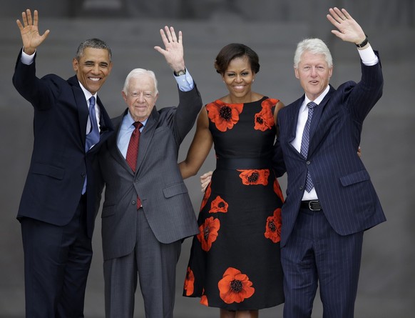 FILE - From left, President Barack Obama, former President Jimmy Carter, first lady Michelle Obama and former President Bill Clinton wave to the crowd from the steps of the Lincoln Memorial in Washing ...