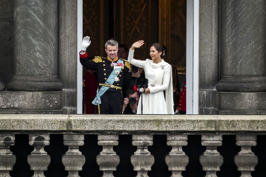 epa11076258 Denmark&#039;s King Frederik X and Queen Mary wave after the proclamation of the accession to the throne at Christiansborg Palace Square in Copenhagen, Denmark, 14 January 2024. Denmark&#0 ...