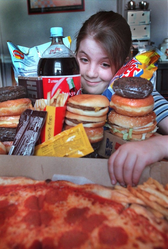 Rebecca Payne of Brookline in awash in junk food at her home. staff Photo Michael fein saved in advance news and photo2 (Photo by MediaNews Group/Boston Herald via Getty Images)