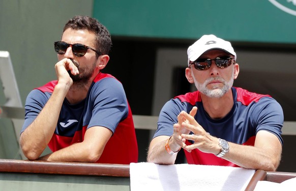 epa06793419 Italian Marco Cecchinato&#039;s coach Simone Vagnozzi (L) and athletic coach Umberto Ferrara (R) watch him playing Dominic Thiem of Austria during their men&#039;s semi final match during  ...