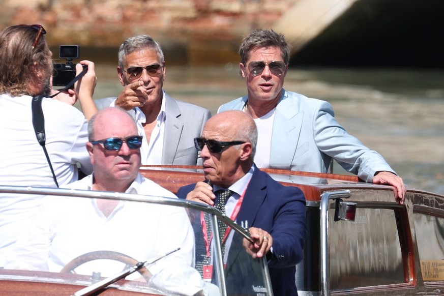 VENICE, ITALY - SEPTEMBER 1: George Clooney and Brad Pitt are seen at the pier of the Palazzo del Cinema during the 81st Venice International Film Festival on September 1, 2024 in Venice, Italy. (Phot ...