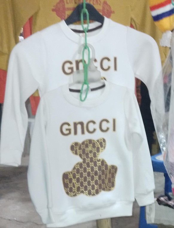 Lustige Fälschung von Gucci. Gncci.