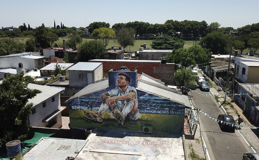 A mural of soccer player Lionel Messi covers the home where he lived in Rosario, Argentina, Wednesday, Dec.14, 2022. (AP Photo/Rodrigo Abd)