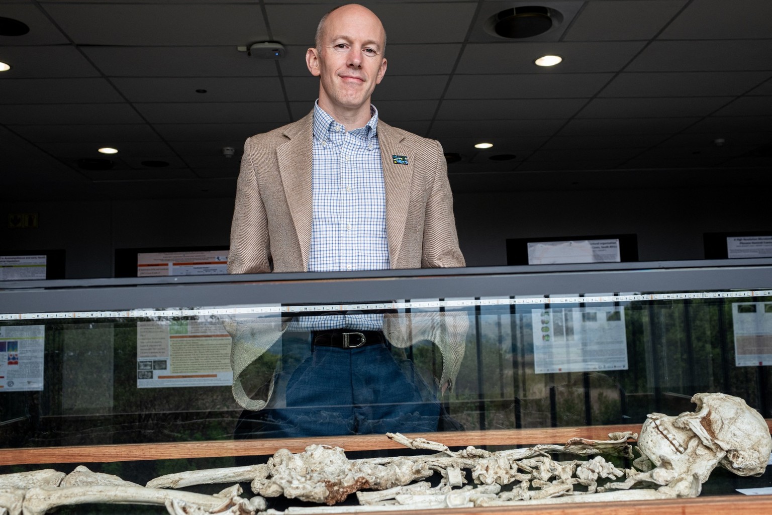 Professor Dominic Stratford, research permit holder at the Wits Sterkfontein Caves, poses for a portrait in front of the osteological reproduction of “Little Foot” fossil skeleton at the Sterkfontein  ...