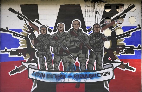 FILE - A mural depicting mercenaries of Russia&#039;s Wagner Group that reads: &quot;Wagner Group - Russian knights&quot; vandalized with paint on a wall in Belgrade, Serbia, on Jan. 13, 2023. Russia& ...