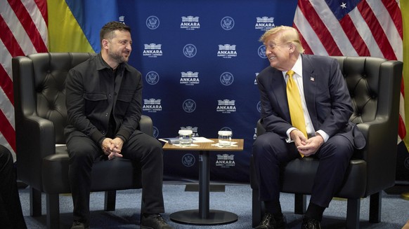 epa13098346 A handout photo made available by the Presidential Press Service shows Ukrainian President Volodymyr Zelensky (L) meeting with US President Donald Trump (R) on the sidelines of the 2026 NA ...