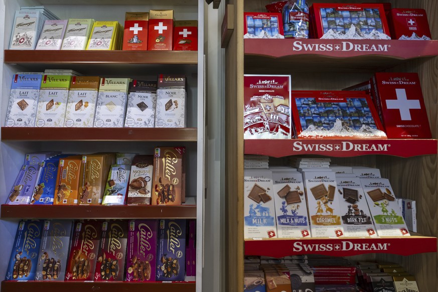 FILE - Swiss chocolate bars from the brands Favarger, Villars, Cailler and Swiss-Dream are photographed in a souvenir shop window on Thursday, April 10, 2025, in Geneva. (Martial Trezzini/Keystone via ...