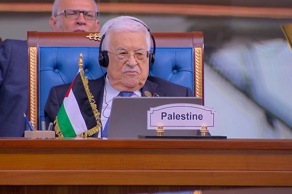 epa11785457 A handout photo made available by the Iranian presidential office shows Palestinian president Mahmoud Abbas during the opening session of the Organization of Eight Developing Countries (D- ...