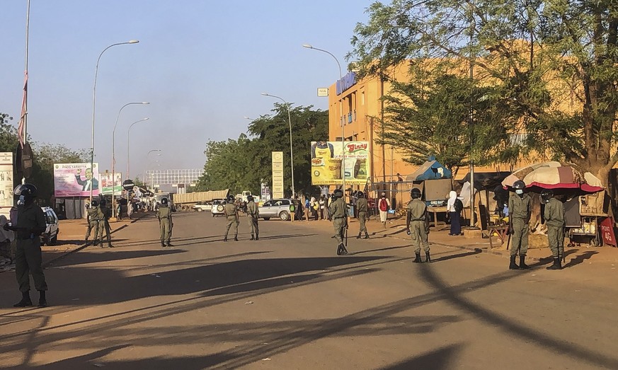 epa09032178 Police seal off a road during clashes with Niger's opposition supporters protesting against presidential run-off results in Niamey, Niger, 23 February 2021. According to provisional r ...