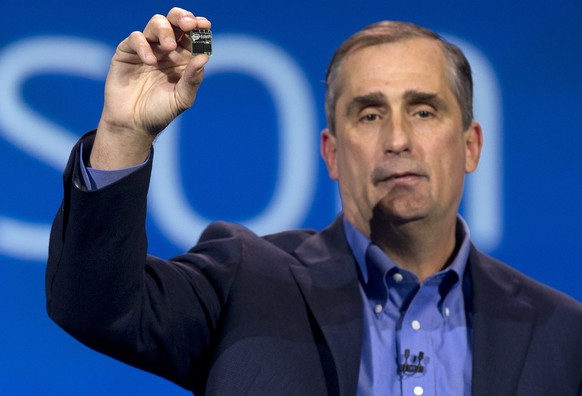 Intel CEO Brian Krzanich holds up Edison, a dual core PC the size of an SD card during a keynote address at the International Consumer Electronics Show, Monday, Jan. 6, 2014, in Las Vegas. (AP Photo/J ...