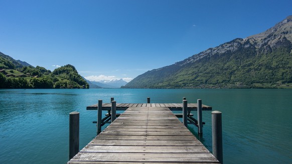 Iseltwald, Switzerland, May 2017: Pier into the lake Brienzersee