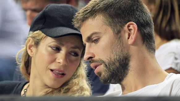 epa04393074 Colombian singer Shakira (L) and FC Barcelona soccer team player Gerard Pique (R) watch the FIBA Basketball World Cup quarter final match between Slovenia and USA played at Sant Jordi Pala ...