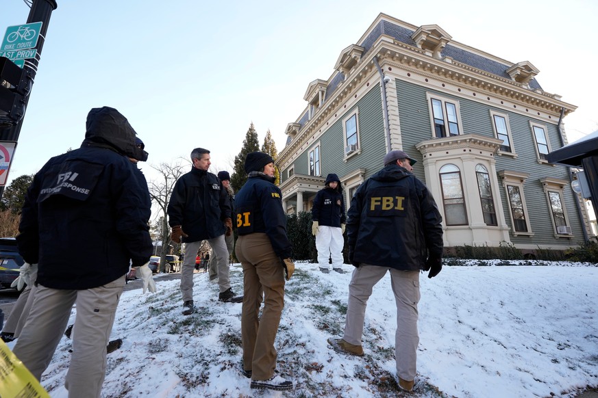 Members of the FBI Evidence Response Team search for evidence near the campus of Brown University, Monday, Dec. 15, 2025, in Providence, R.I. (AP Photo/Robert F. Bukaty)
Brown University Shooting