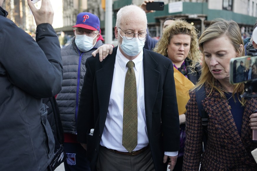Robert Hadden, center, leaves the federal courthouse in New York, Tuesday, Jan. 24, 2023. Hadden, a gynecologist who molested patients during a decades long career, was convicted of federal sex traffi ...